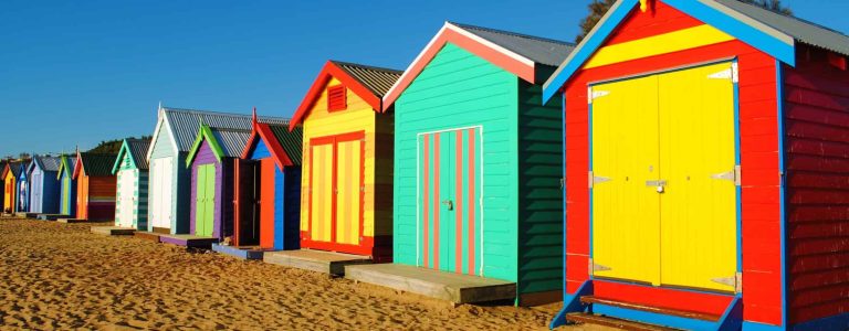 Colourful bathing boxes line the foreshore at Brighton Beach
